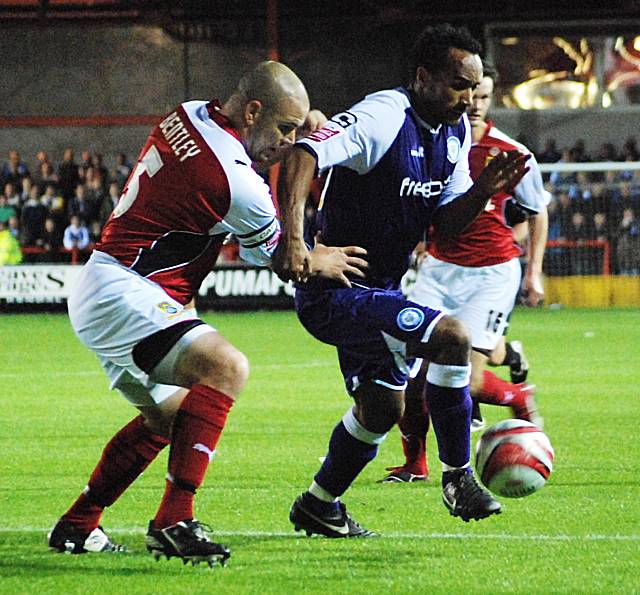 Chris O'Grady holds the ball up from Jim Bentley.