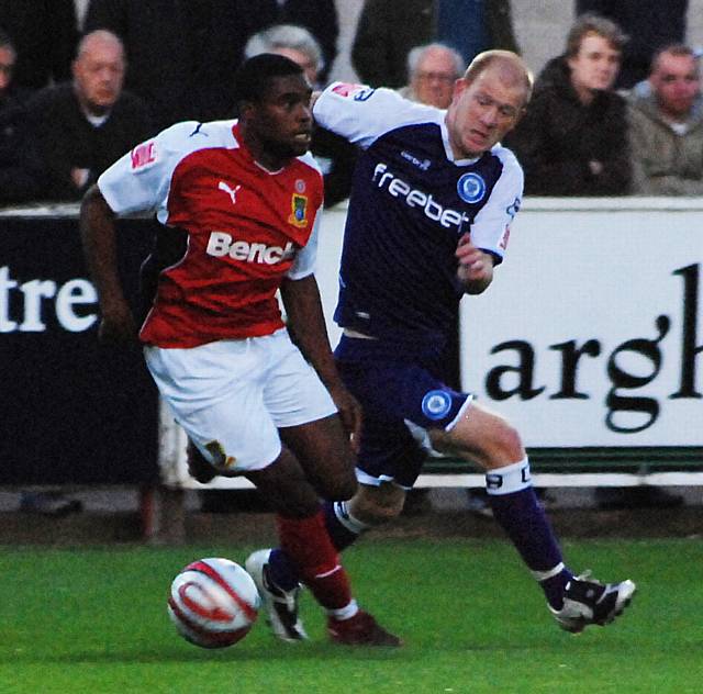 Emmanuel Panther keeps the ball away from Jason Kennedy.