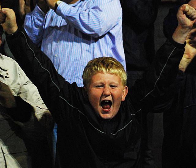 A young Dale fan joins in the celebrations for Thompson's goal.