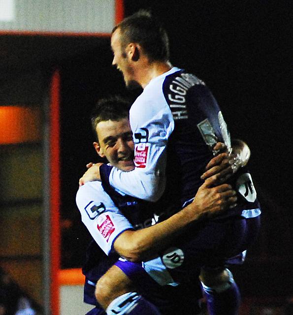 Stephens celebrates his goal with Higginbotham.