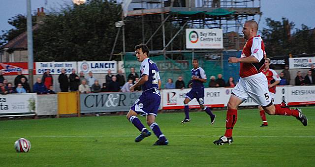 Will Buckley goes clear in the Morecambe box but Roche is equal to his tame finish.