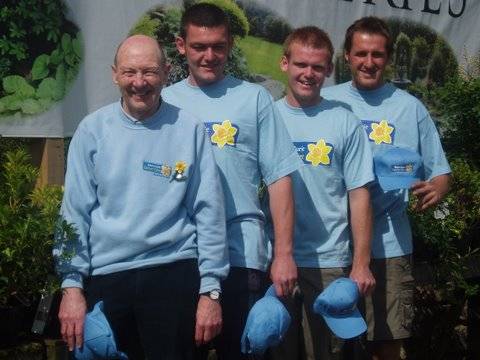 Eddie Holden of the Rochdale Support group of Marie Curie cancer alongside triathletes Michael Nelson, Liam Mulderrig and Adrian Woodrup.