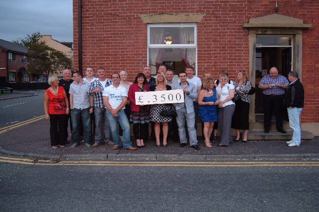 The Horse and Jockey locals with landlord Steven Wild and event organiser Debra Brown with Kath Meredith from Springhill Hospice 