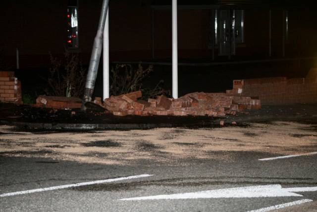 The damaged lamp post and wall