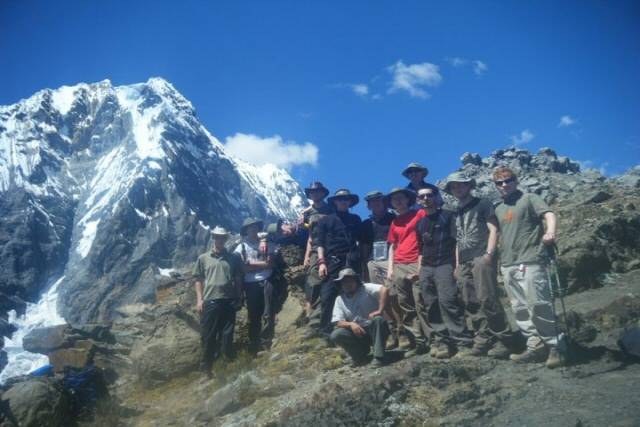 Kiefer, left,(wearing green) with his team at the peak of their trek


