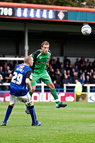 Rochdale 3 - 2 Dagenham and Redbridge<br />
Scott Doe heads watched by Nicky Adams