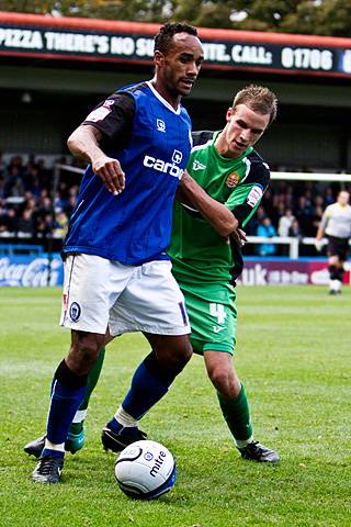 Rochdale 3 - 2 Dagenham and Redbridge<br />
Chris O'Grady shields the ball from Scott Doe