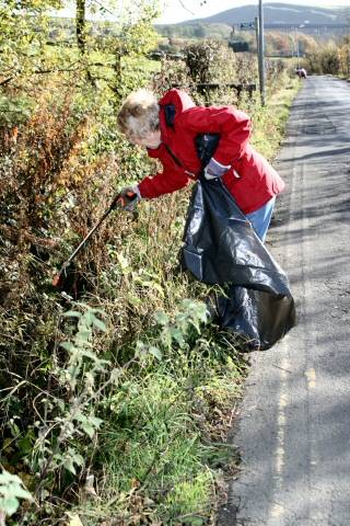 Volunteer Christine Winn getting stuck in