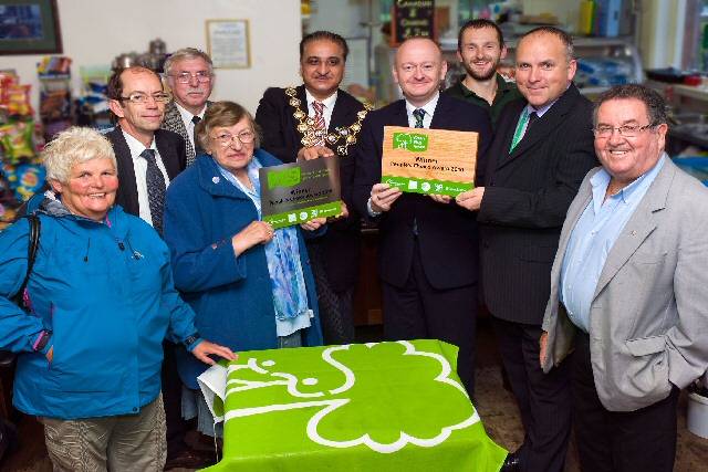 Queen’s Park friends group chairwoman, Sheila Hill, and Rochdale Borough Council’s Parks and Street Scene Manager Mick Ripley proudly show off the People’s Choice Award plaques - presented by Keep Britain Tidy’s Paul Todd and supported by Mayor Councillor Zulfiquar Ali, Councillors Colin Lambert and Peter Rush, and other members of the Friends of Queen’s Park