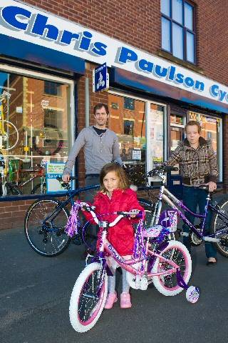 Philip (back, left), Terri (back, right) and Elise with their new bikes