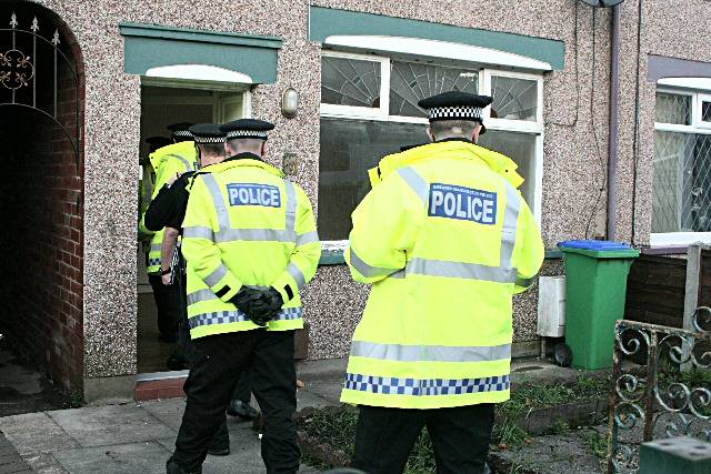 Officers entering another house on Park Road