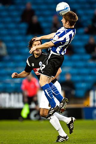 Sheffield Wednesday 2 - 0 Rochdale<br />James O'Connor heads with Brian Barry-Murphy close by