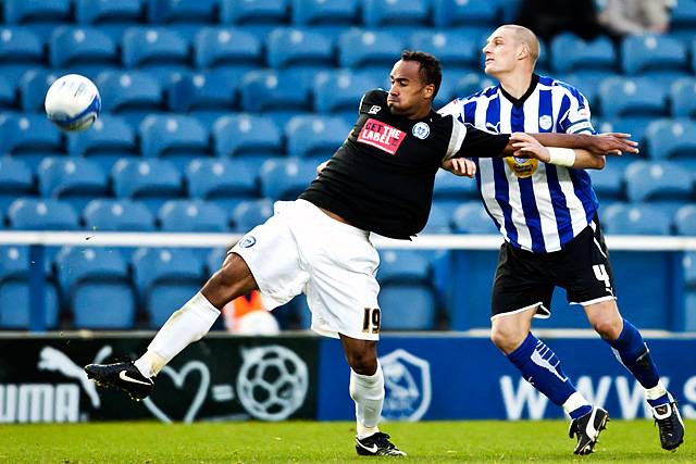 Sheffield Wednesday 2 - 0 Rochdale<br />Chris O'Grady fends off Darren Purse