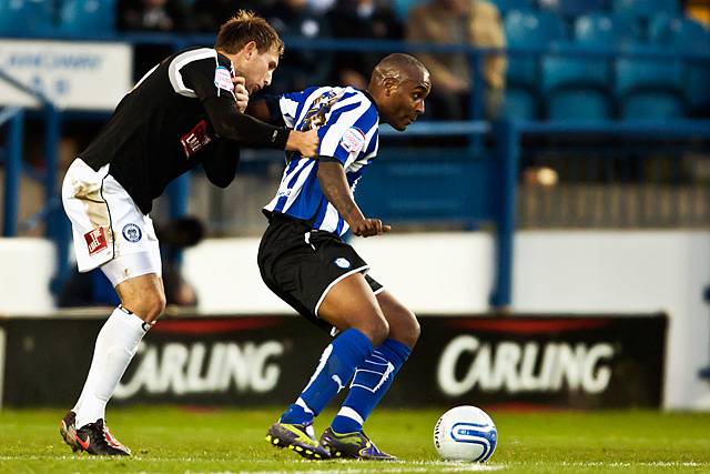 Sheffield Wednesday 2 - 0 Rochdale<br />Clinton Morrison shields the ball from Craig Dawson