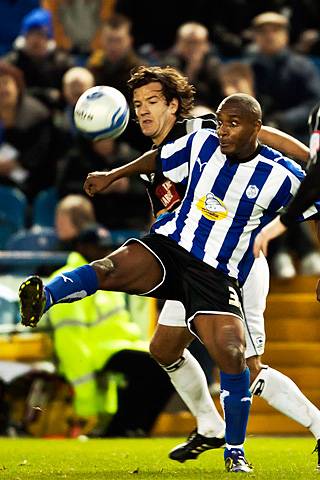 Sheffield Wednesday 2 - 0 Rochdale<br />Clinton Morrison has close attention from Brian Barry-Murphy 