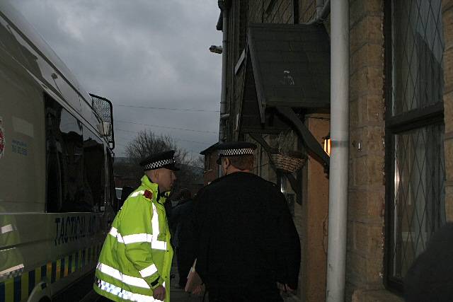 Police outside a property in the early morning raids