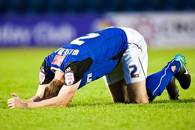 Rochdale 3 - 3 Swindon Town<br />Scott Wiseman feels the pain after one of many heavy Swindon challenges