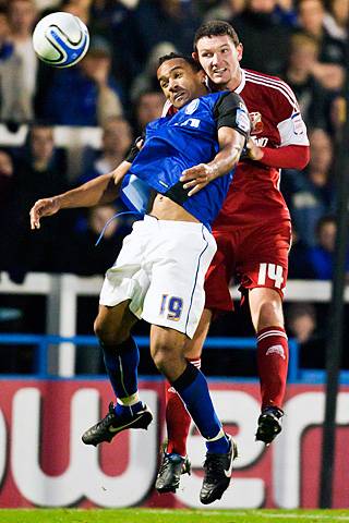 Rochdale 3 - 3 Swindon Town<br />Sean Morrison and Chris O'Grady battle in the air