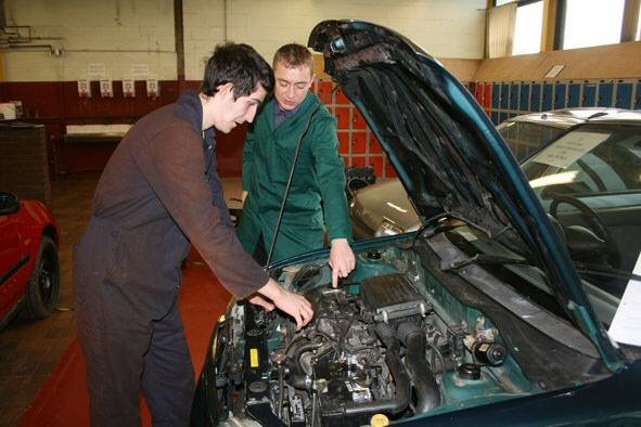 Motor Vehicles students work on a donated car