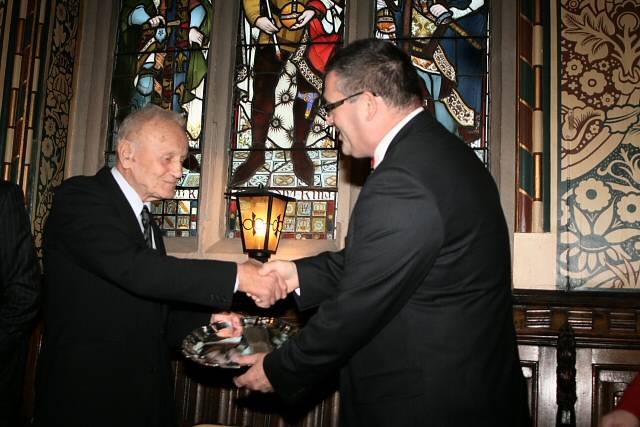 Garry Whitworth accepting the Man of the Year plate from 2009 Rochdale Man of the Year, Roman Paraszczak