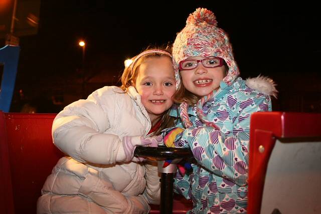 Girls wrapped up for winter on one of the rides