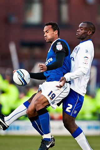 Rochdale 1 - 1 Oldham<br />Chris O'Grady with Jean Yves Mvoto challenging