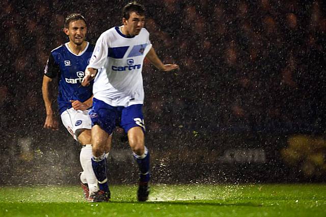 Rochdale v Oldham Athletic – abandoned due to torrential rain rendering the playing surface dangerous - Dawson and Oldham's Miller can hardly see for the rain