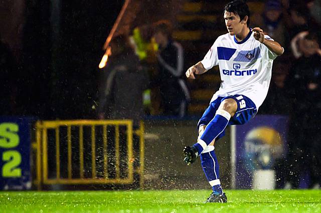 Rochdale v Oldham Athletic – abandoned due to torrential rain rendering the playing surface dangerous - Oldham's Kieran Lee kicks more water than ball!