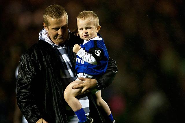 Rochdale v Oldham Athletic – abandoned due to torrential rain rendering the playing surface dangerous - a brave young mascot has only been on the pitch for a few minutes and is soaked