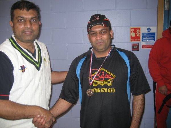 Bari of Baba XI receiving his man of the match award from Iqbal of RYCC.