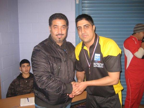 Shoaib of Max XI receiving his man of the match award from Atique Malik of Home 2 Home furnishing.