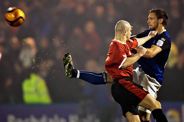 Rochdale v FC United of Manchester - Craig Dawson clears the ball but gets 'chinned' by Mike Norton in the process!