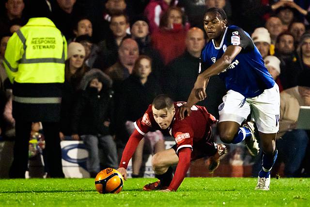 Rochdale v FC United of Manchester - Jean-Louis Akpa-Akpro gets the better of Scott McManus