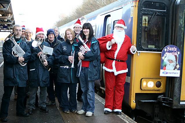 Members of STORM, Littleborough Brass Band and Santa ready to board the 08.53am Sunday service