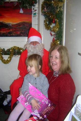 Santa with Emily and her Grandma Liz White