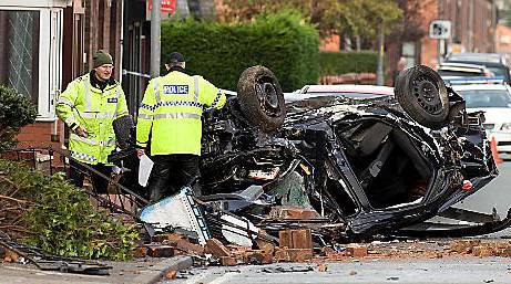 The aftermath of the crash in Middleton Road, Chadderton, in which three people were killed. 