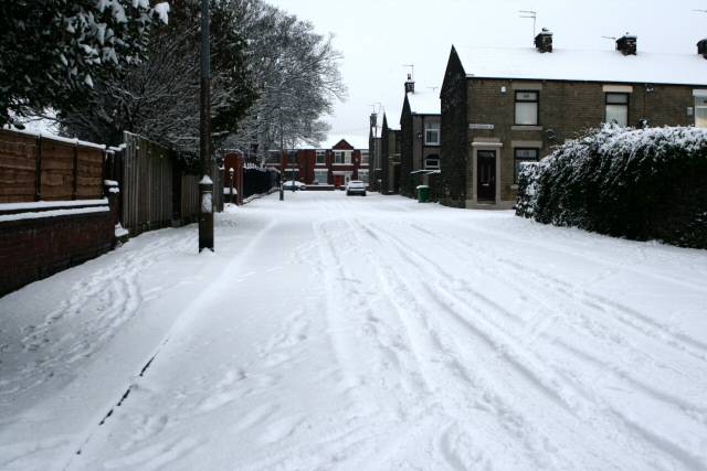 Snow piling up on a side street