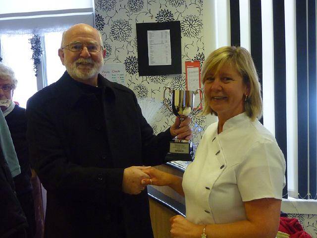 Janet Rawlinson being presented her trophy by Steve Lister 