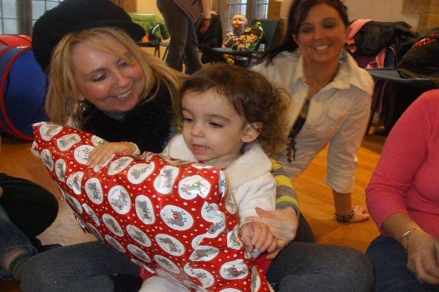 Xela Mills plays pass the parcel with her mum Claire Mills and Grandma Dawn Smith