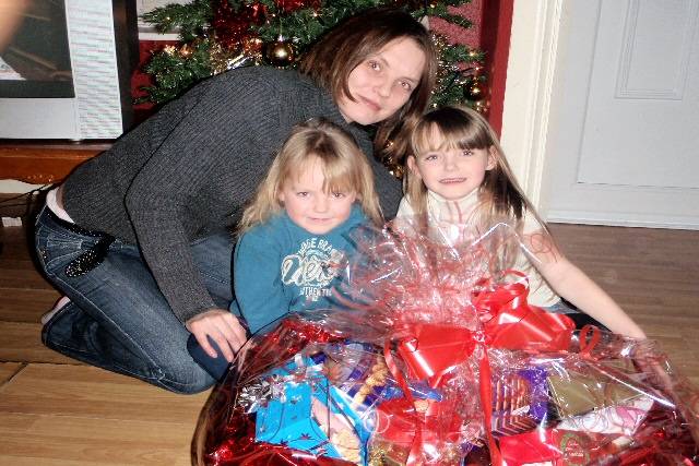 Sophie, Chloe and mum with their winning bumper hamper