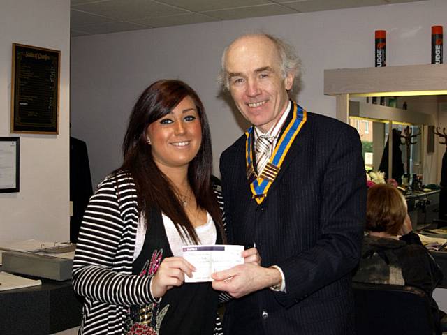 President Elvet of the Rochdale Club and present winner Renata with her cheque of £300