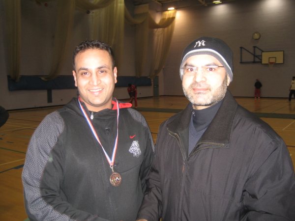 Munawar of Unique receiving man of the match medal from A Quyyom (Chief organiser RSCL).