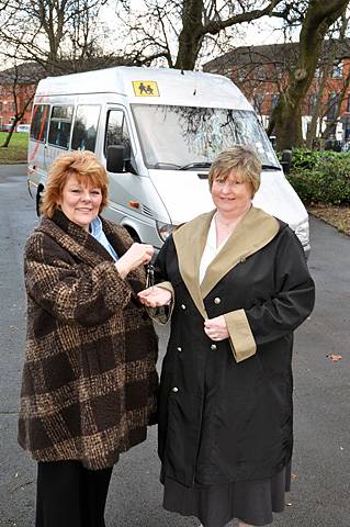 Mary Burke from  the Volunteer Driver Service receives the keys to a minibus donated by Greater Manchester Integrated Transport Authority 