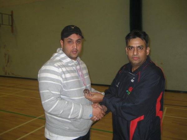 Munawar of Unique receiving man of the match award from M Siddique of RSCL