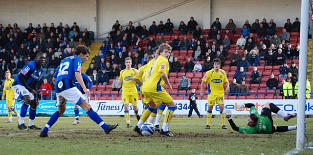 Atkinson comes close to turning O'Grady's cross in at the far post.