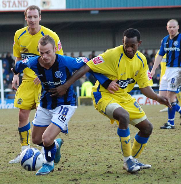 Higginbotham grapples with Jon Nurse.