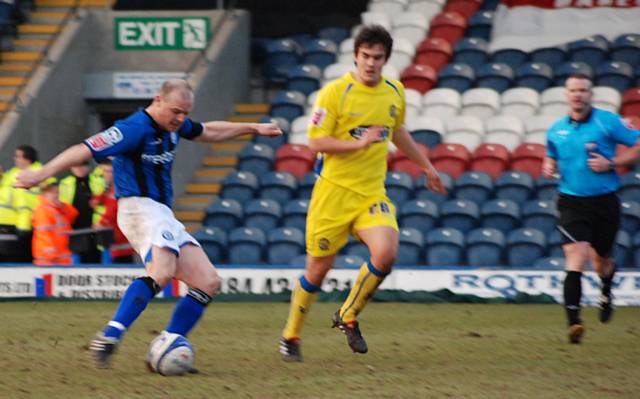 Gary Jones fires the shot that gives Rochdale the lead.