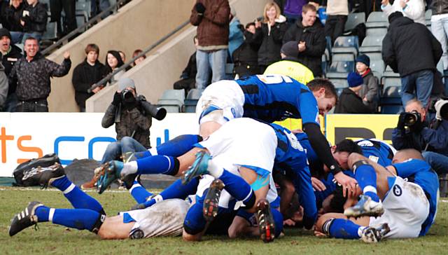 All of the players join Jones in celebration.