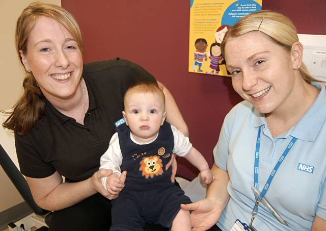 Community Children's Nurses, Jo Mark (L) and Lisa Bancroft with baby Ben Neilson