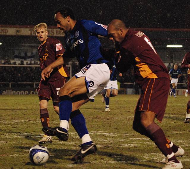 Chris O'Grady holds the ball away from Matt Clarke.